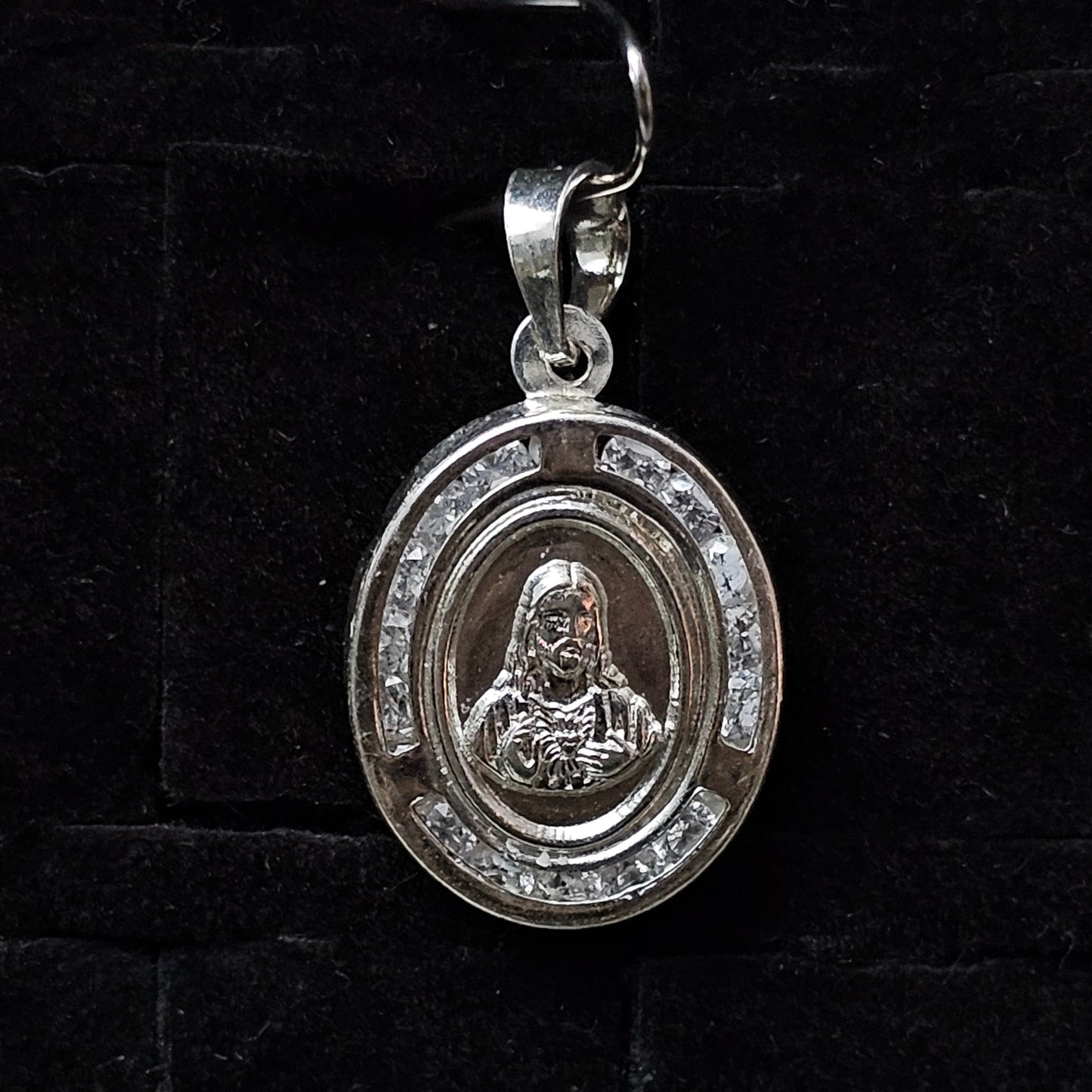 Oval Sterling Silver Jesus Pendant with white CZ Halo
