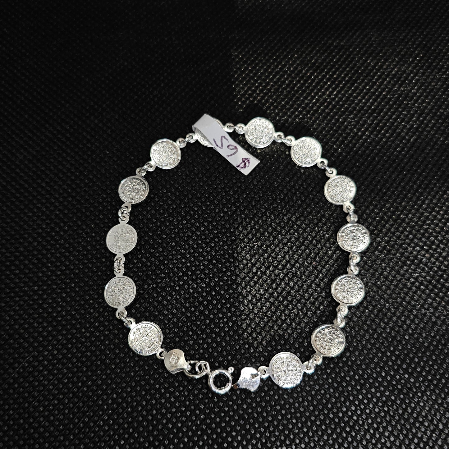 Elegant Silver Coin Bracelet with Textured Medallion Design