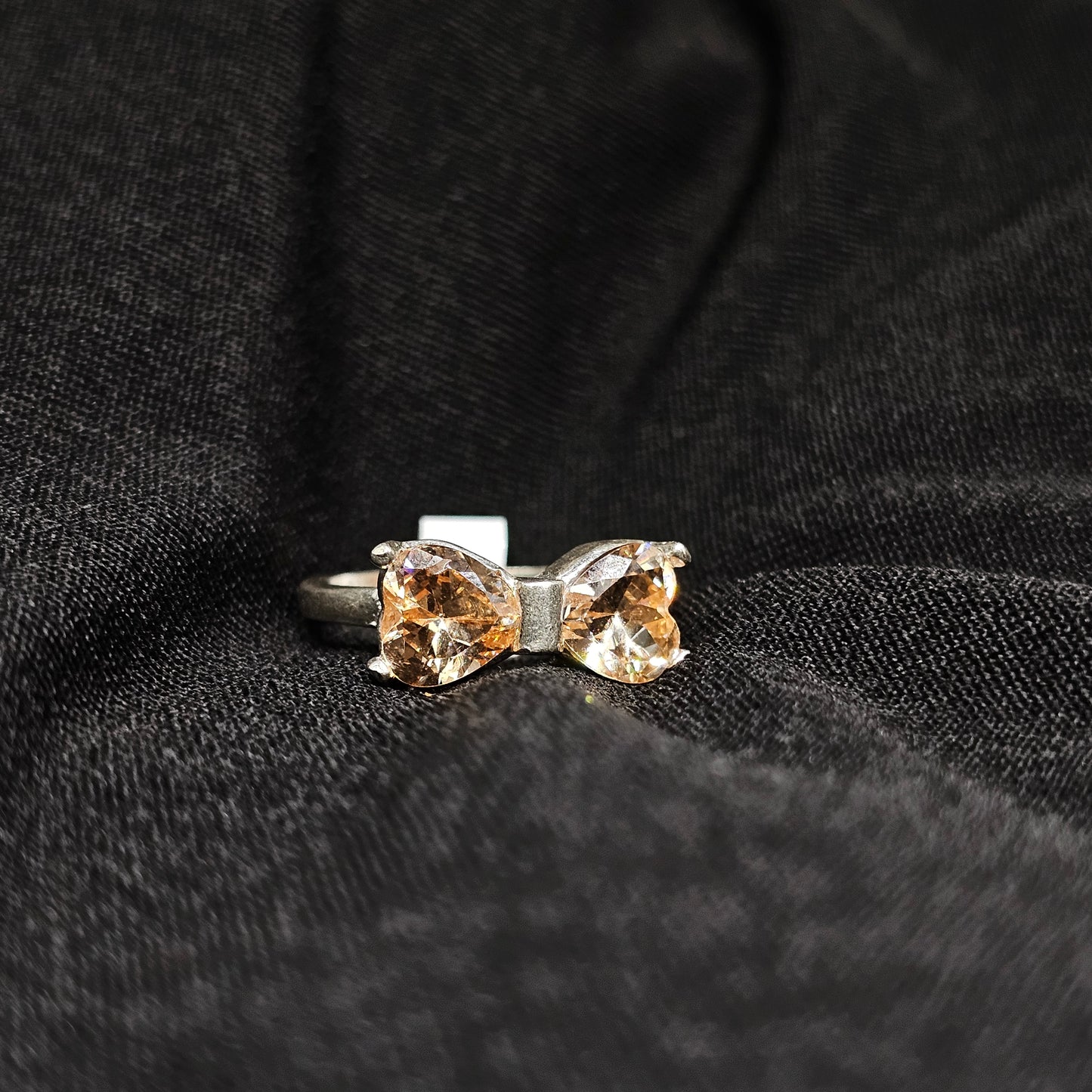 Bow Design Champagne Gemstone Ring in Silver Tone – Size 6