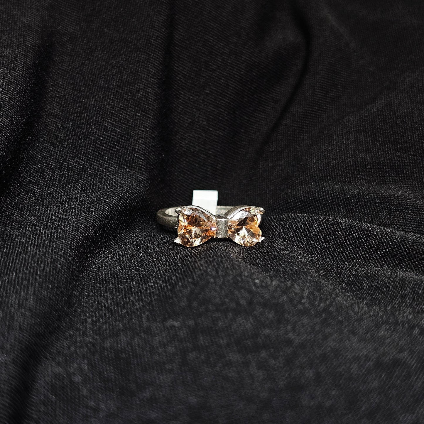 Bow Design Champagne Gemstone Ring in Silver Tone – Size 6